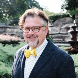 Image of Dr Godat, links to his bio page