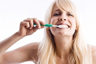Woman Brushing Teeth